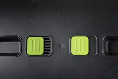 Green pedals on a black surface